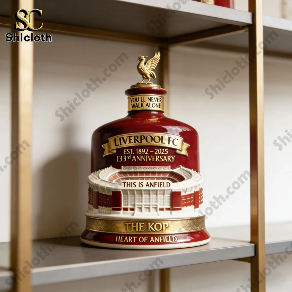 Liverpool FC 133rd Anniversary Heritage Collector Bottle placed on a shelf surrounded by memorabilia.