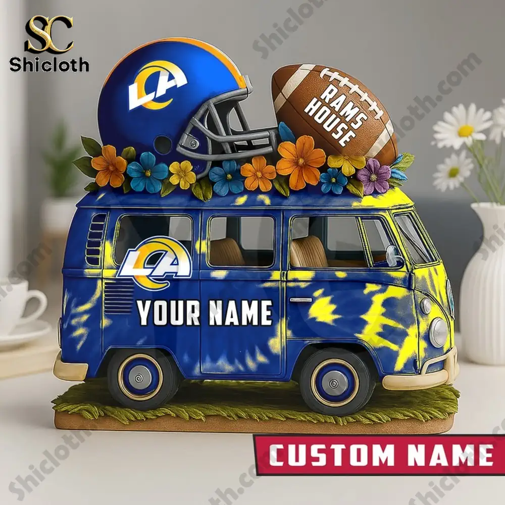 Los Angeles Rams van decor with helmet and football on top.