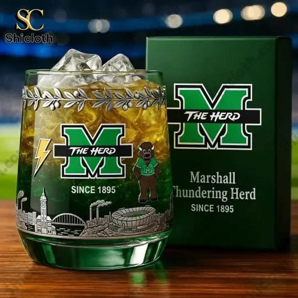 A closeup of a Marshall themed glass with ice beside a branded box in a stadium setting!
