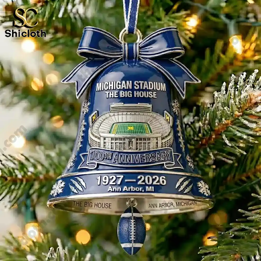 Blue bell ornament celebrating the Michigan Stadium centenary on a Christmas tree.
