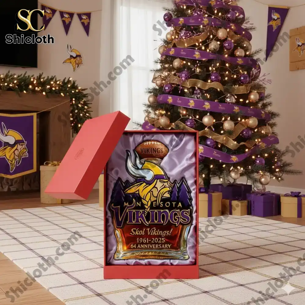 A commemorative Minnesota Vikings themed bottle displayed in an open gift box in a holiday decorated living room.