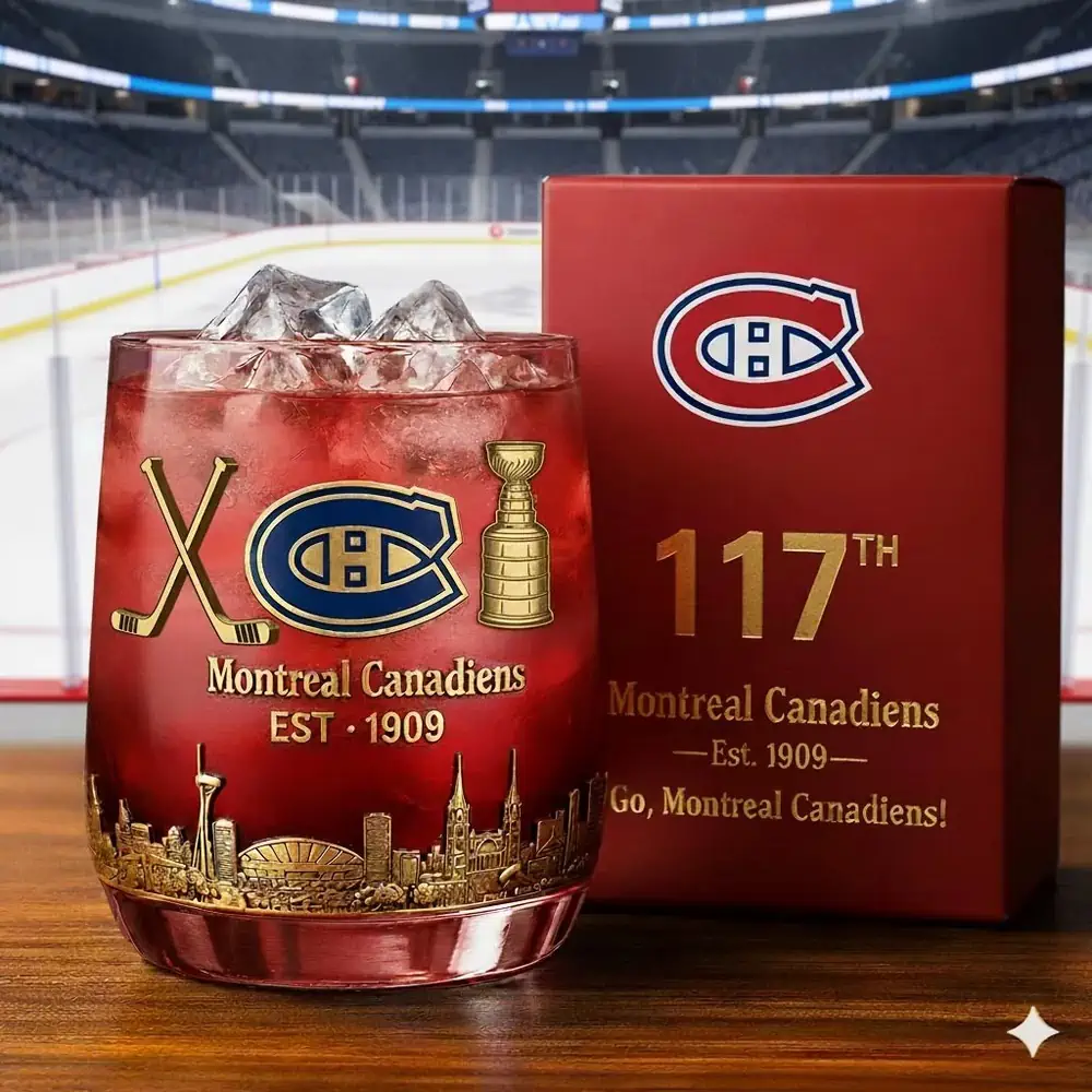Montreal Canadiens 117th Anniversary Christmas Whiskey Glass 3 A filled Montreal Canadiens commemorative glass beside its gift box in front of an ice rink.