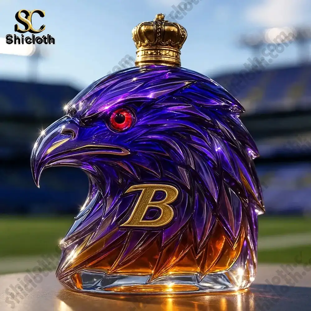 A purple and gold eagle shaped whiskey bottle with a gold cap displayed in a stadium setting!