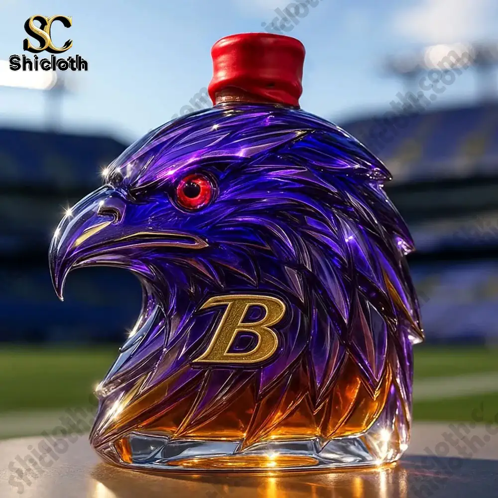 NEW 2025 Limited Edition Baltimore Ravens Christmas Gift Whiskey Bottle 4 A purple and gold eagle shaped whiskey bottle with a bright red cap!