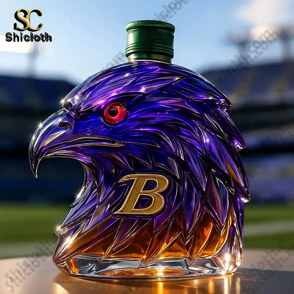 NEW 2025 Limited Edition Baltimore Ravens Christmas Gift Whiskey Bottle 5 A purple and gold eagle shaped whiskey bottle with a green cap!