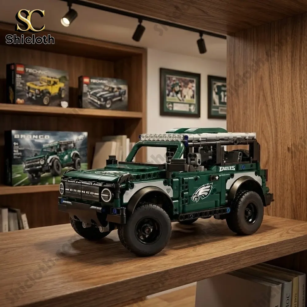 A brick built green Bronco vehicle with Eagles branding displayed on a wooden shelf.