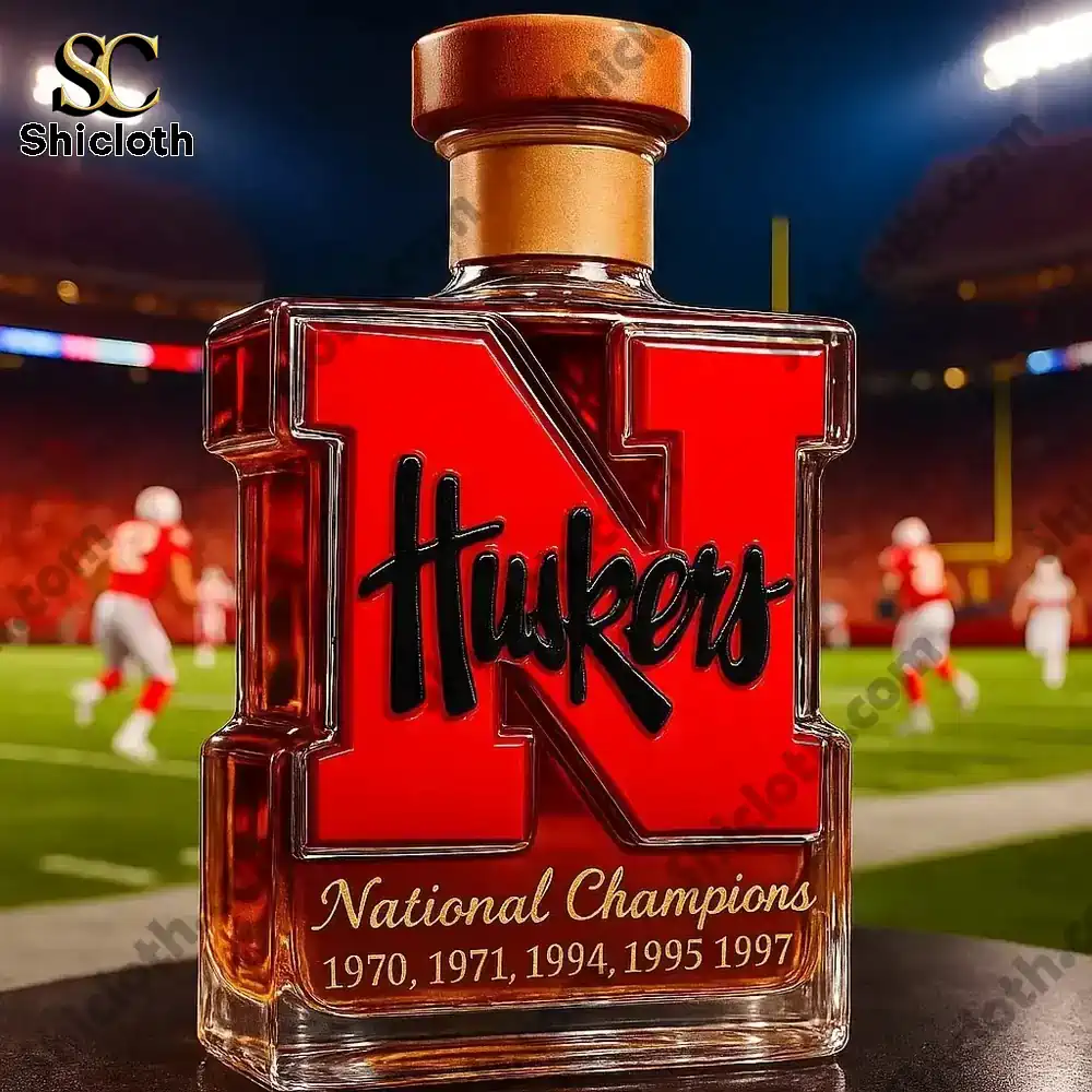 Nebraska Cornhuskers 5-Time National Champions Christmas Gift Whiskey Bottle 4 Nebraska Huskers N shaped bottle with a gold cap on a football field!