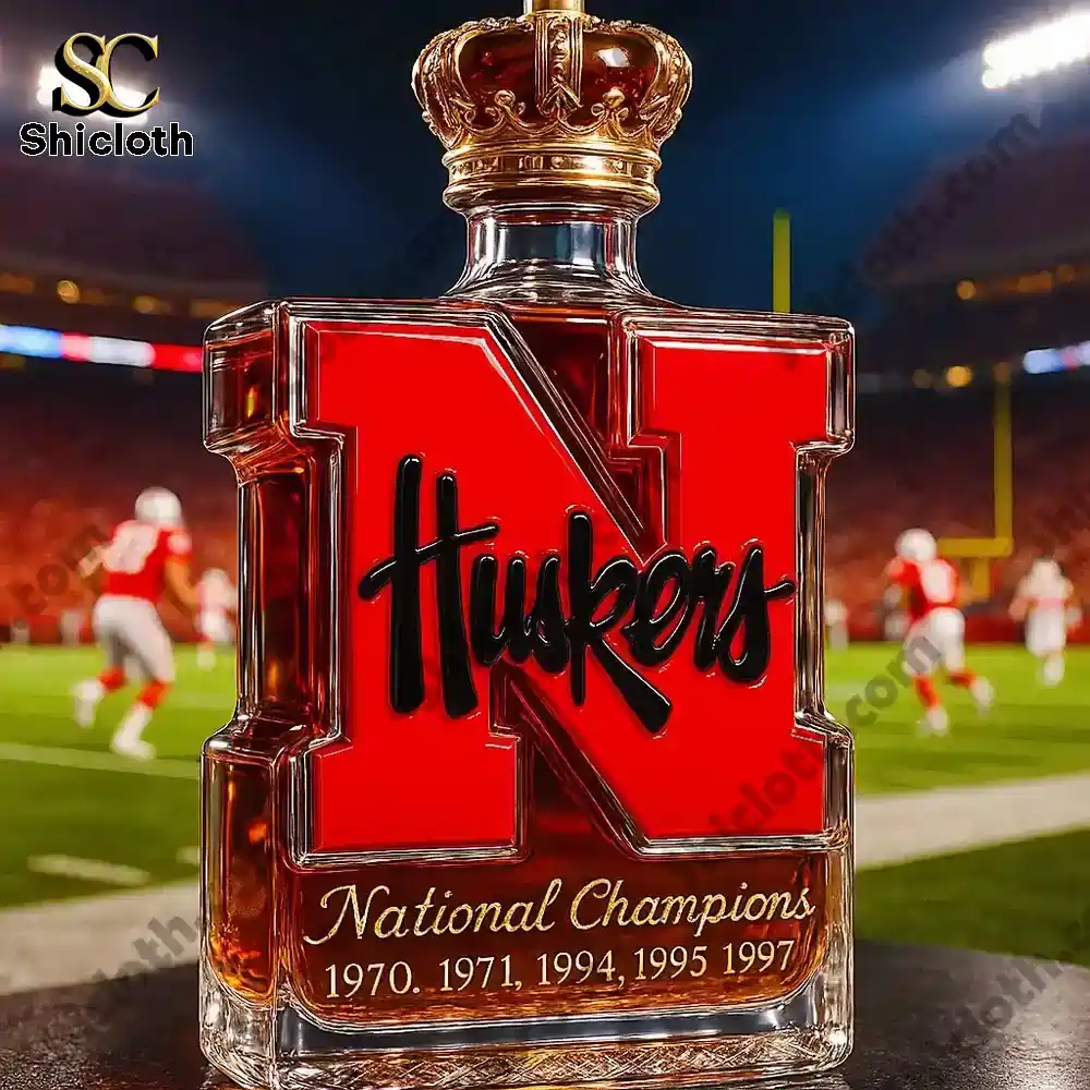 Nebraska Cornhuskers 5-Time National Champions Christmas Gift Whiskey Bottle 5 Nebraska Huskers N shaped bottle with a crown top displayed on a football field!
