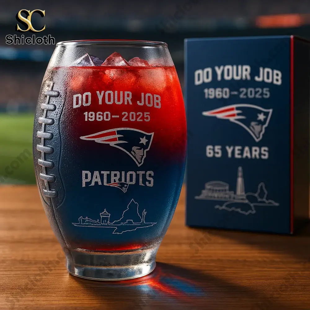 Patriots anniversary glass with red and blue drink on wooden table!