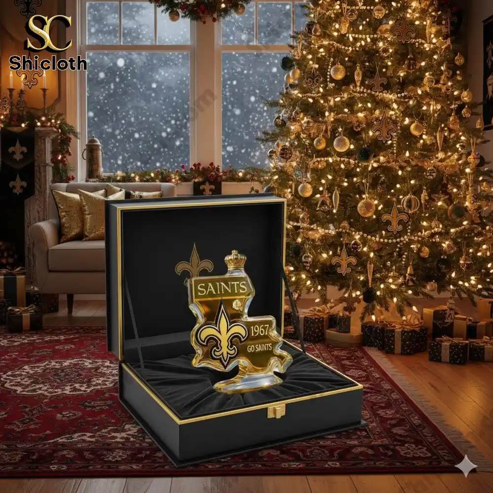 New Orleans Saints whiskey decanter gift box beside a Christmas tree!