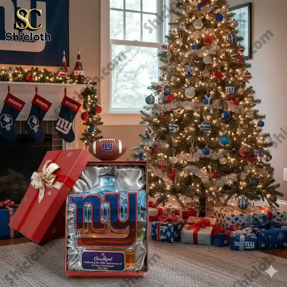 A New York Giants logo shaped whisky bottle displayed in a holiday themed room with a Christmas tree and gifts.