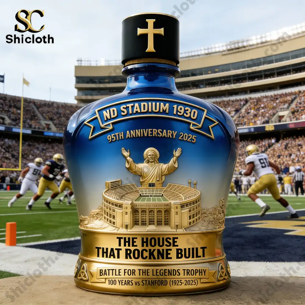 A Notre Dame 1930 Stadium anniversary whiskey bottle in front of a football field with players, celebrating the 100th anniversary of the rivalry against Stanford.