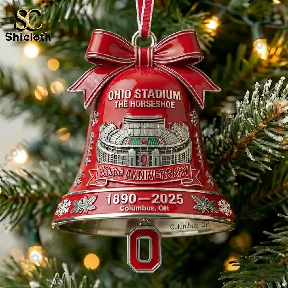 Close up of a red Ohio Stadium anniversary bell ornament hanging on a Christmas tree!