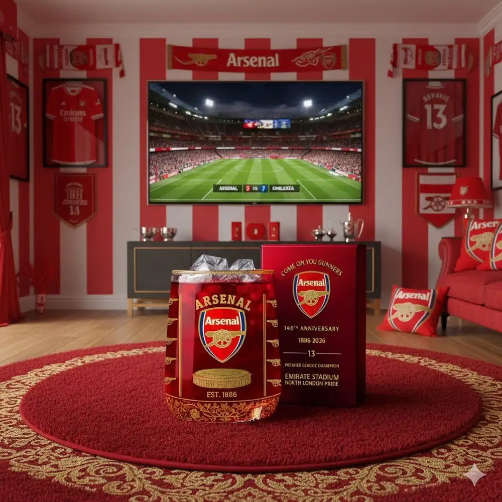 A commemorative Arsenal glass displayed in a fan themed room with a match on screen!