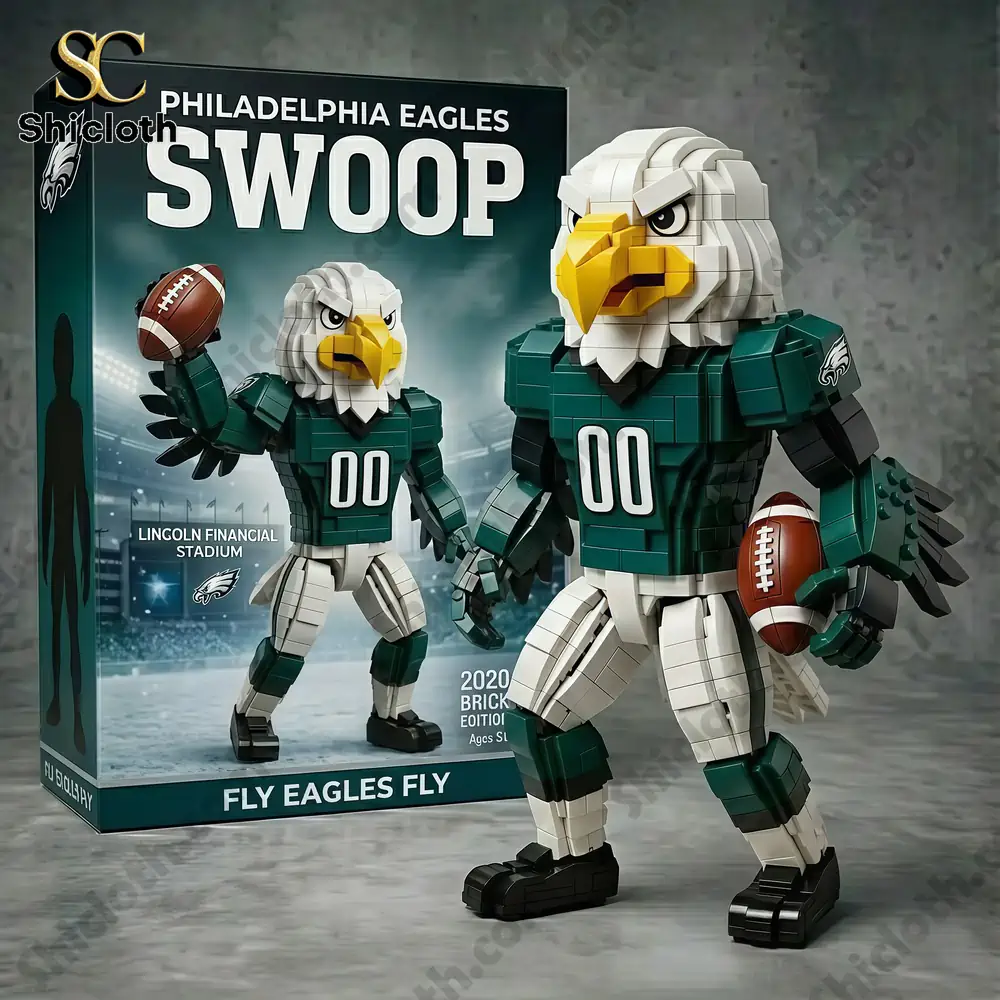 A completed Swoop building block figure standing next to its box inside a glass display case with Eagles memorabilia!