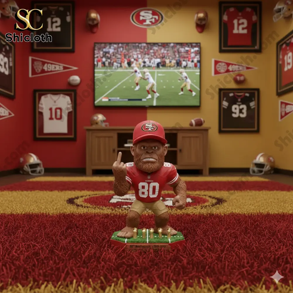 Bigfoot figure on a red shag carpet inside a San Francisco 49ers themed room with jerseys and helmets!