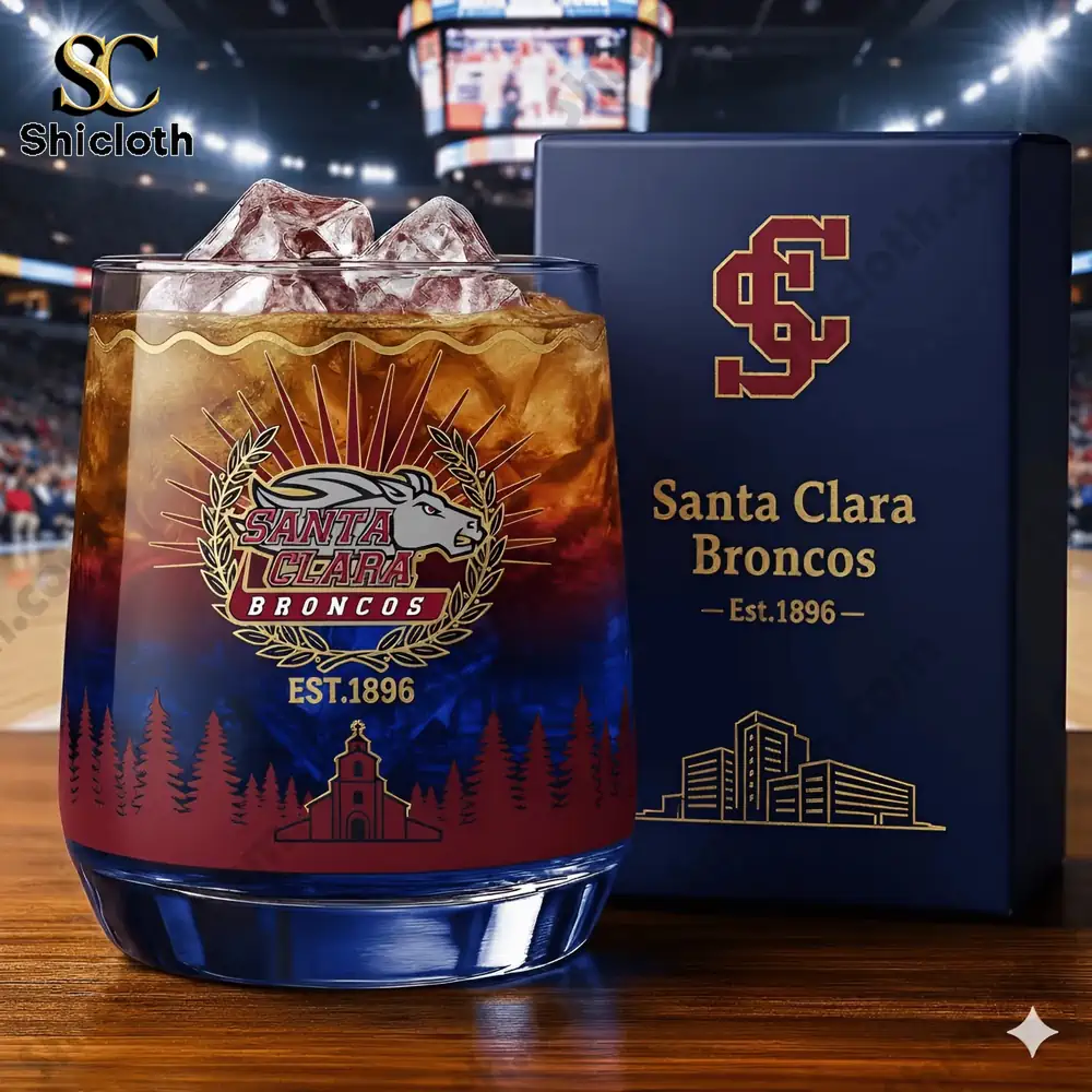 A closeup of a Santa Clara Broncos glass with ice in a stadium setting.