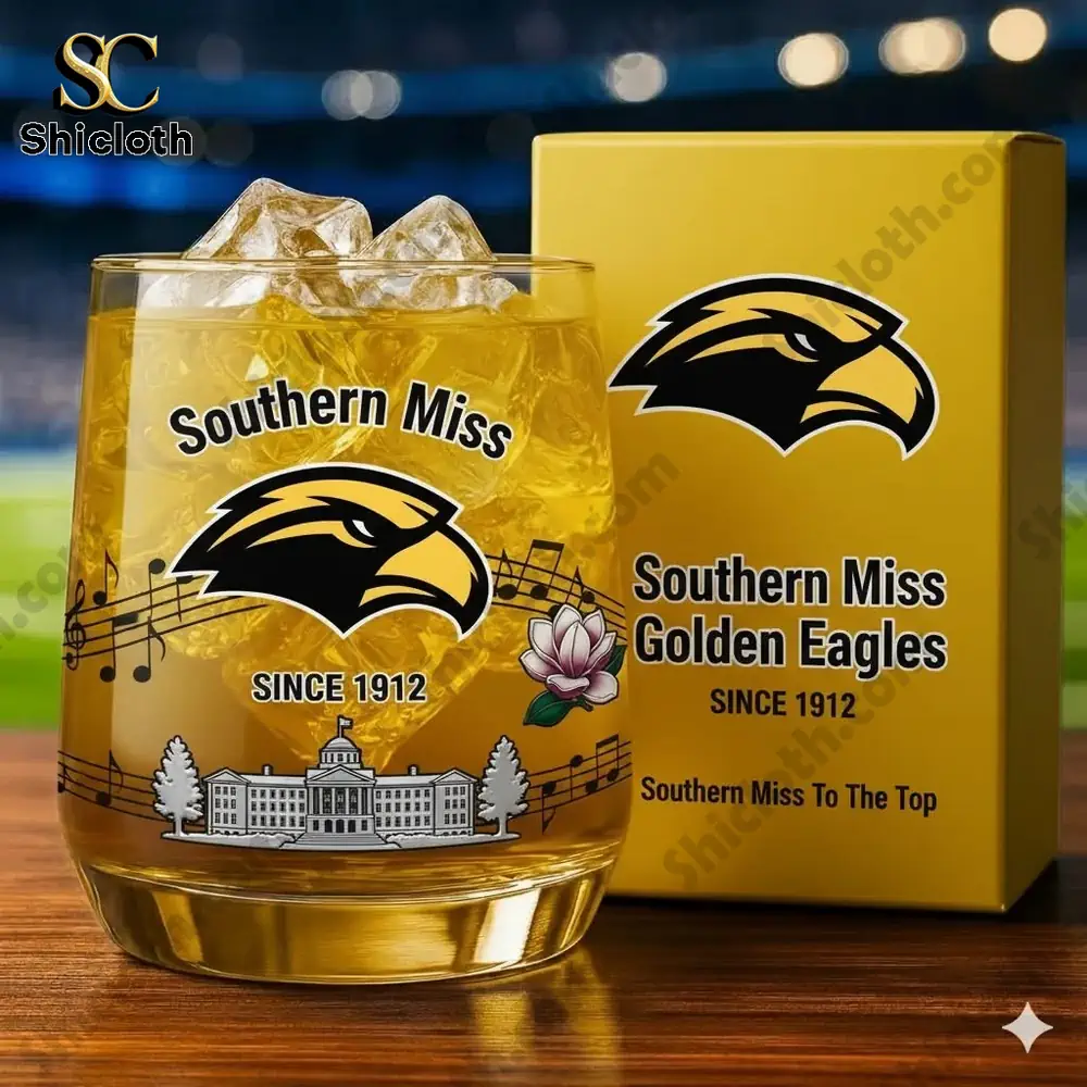 A Southern Miss branded glass with ice and a matching box featuring the golden eagle logo on a table!