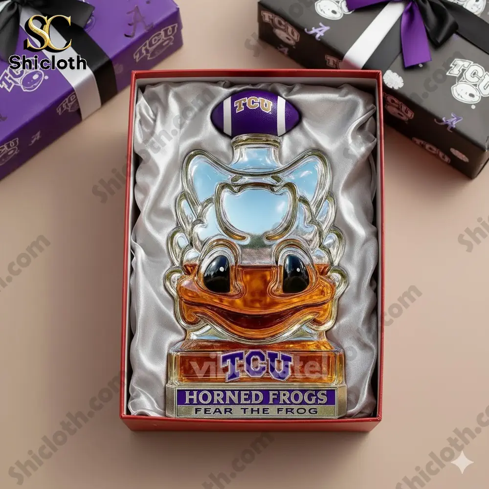 A limited edition TCU Horned Frogs mascot whiskey bottle with a crown, presented in a gift box featuring TCU branding.