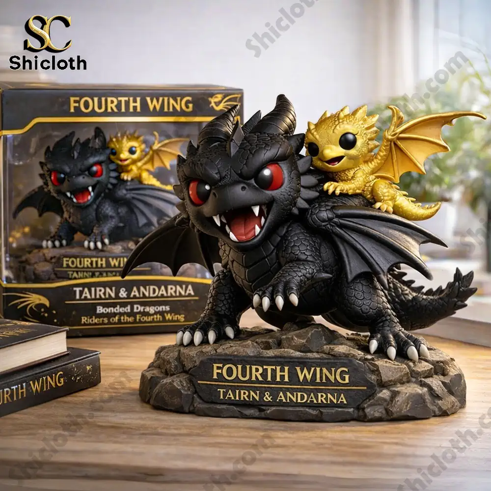 Black and gold dragon figures on a rocky base with a product box and books.
