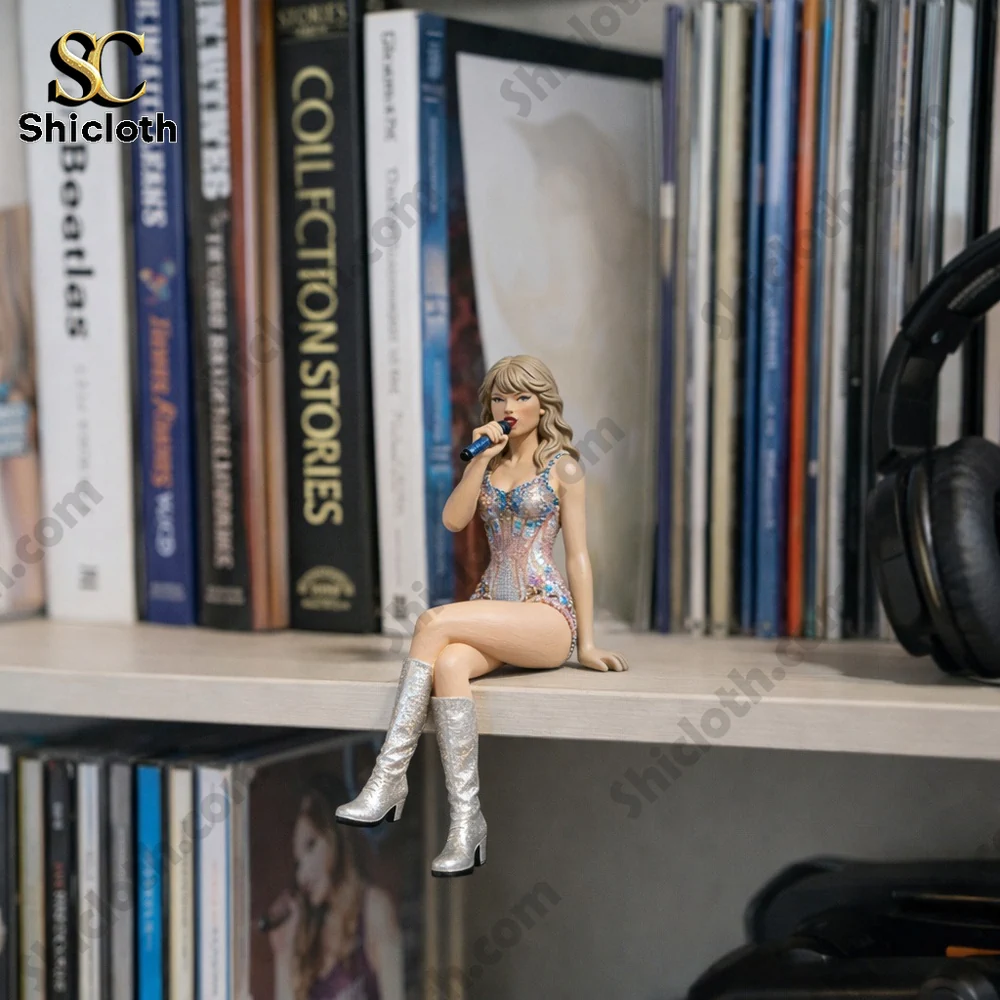 Mini female singer figurine sitting on a bookshelf!