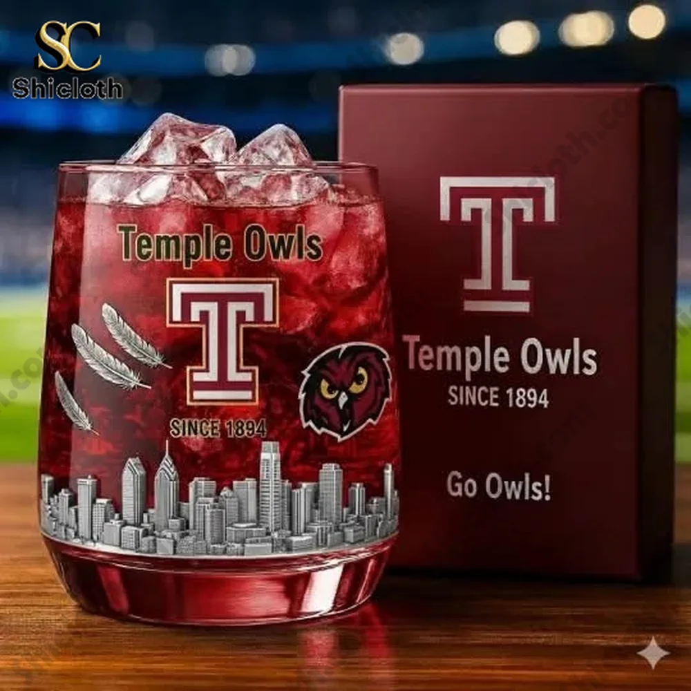 A Temple Owls glass with ice and a display box next to it on a table!
