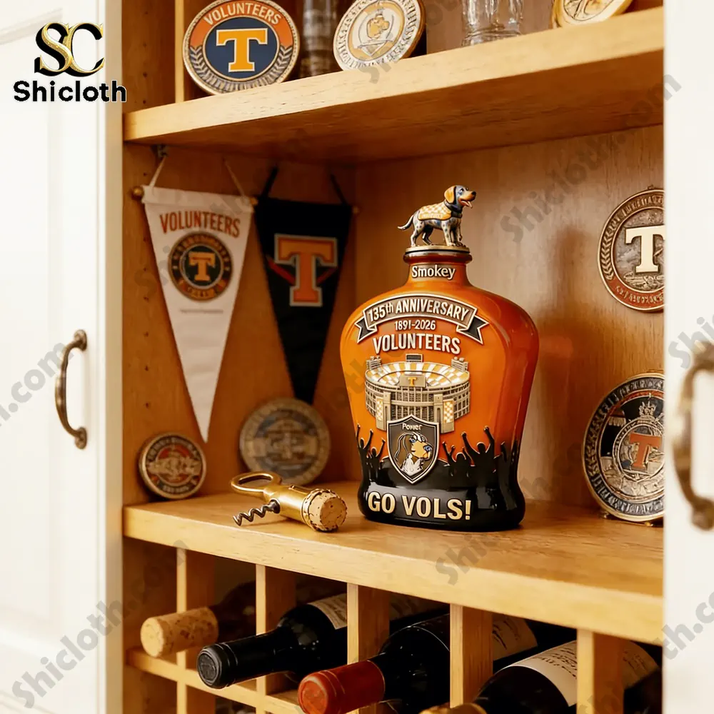 Tennessee Volunteers whiskey decanter displayed on a shelf with memorabilia and wine bottles.