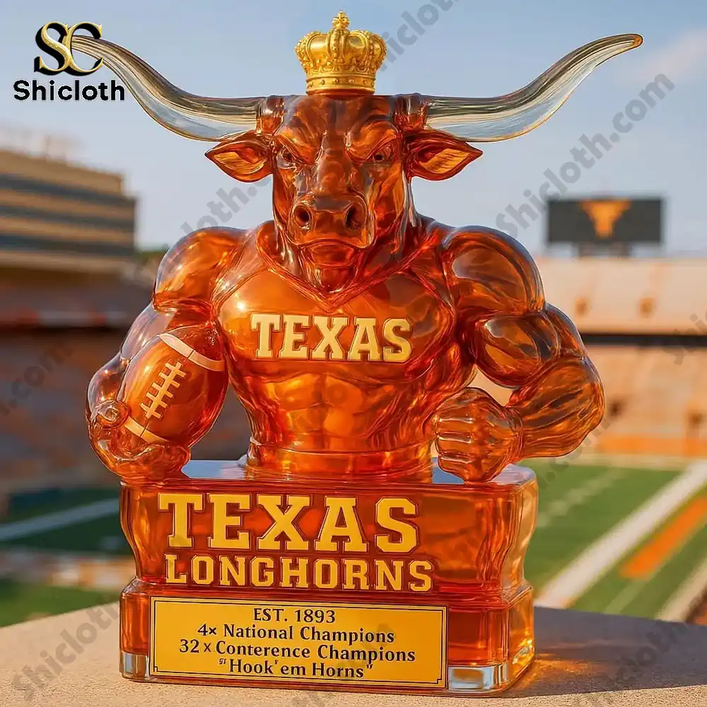 Orange bull statue with Texas text displayed on a football field.