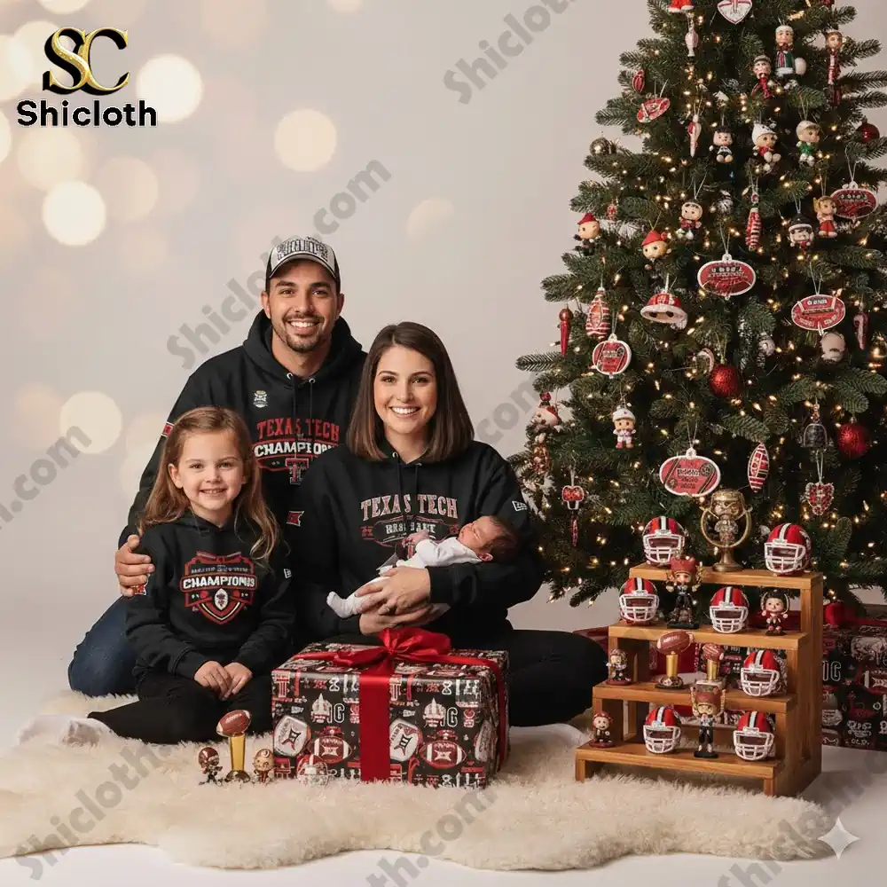 Family wearing Texas Tech championship hoodies posed near a decorated Christmas tree.