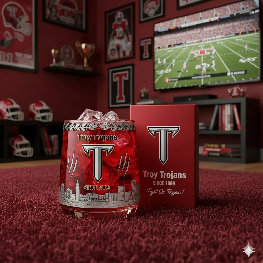 A red glass with Troy Trojans logo placed in a football themed room!