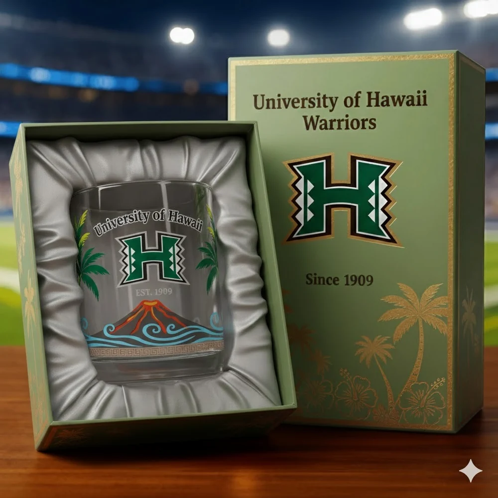 An opened gift box displaying a University of Hawaii themed glass in a stadium environment!