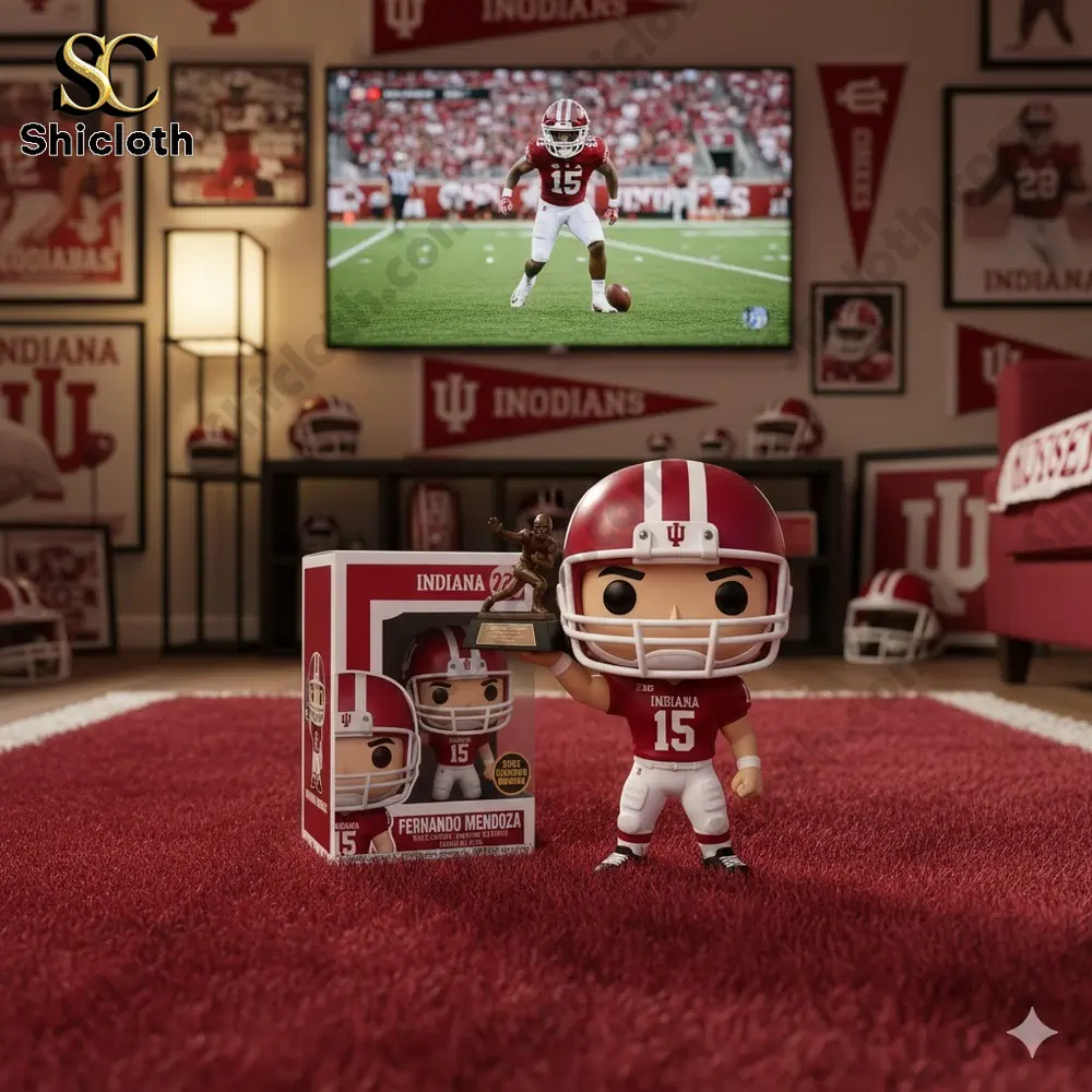 A pop figure of a football player holding a Heisman trophy with a stadium background and Indiana team decorations.