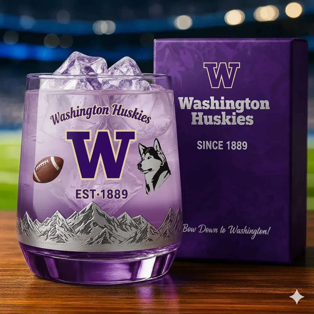 Washington Huskies Christmas Whiskey Glass 3 A Washington Huskies glass with ice placed beside a matching purple gift box.