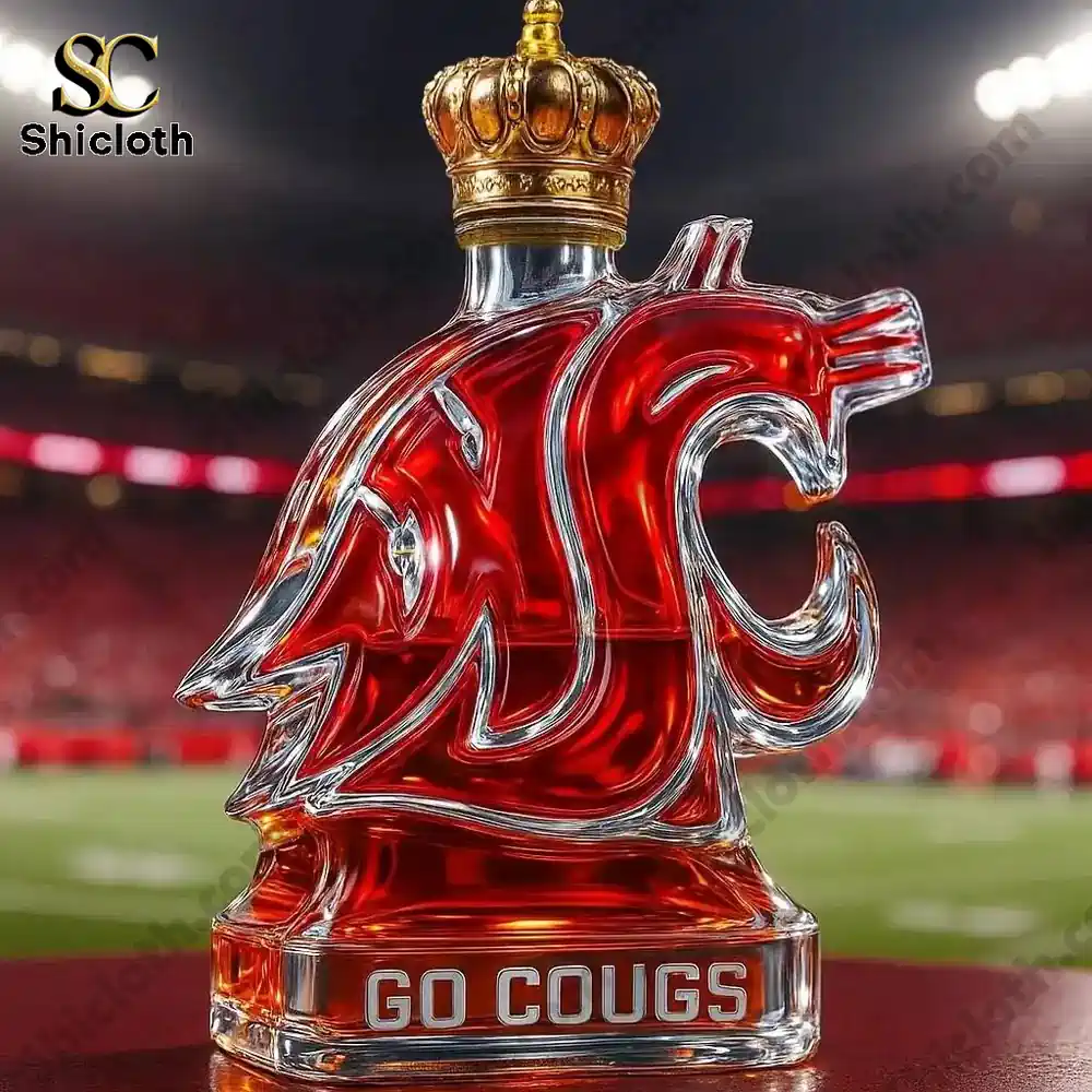 A close view of a glass cougar logo display filled with red liquid against a stadium background!