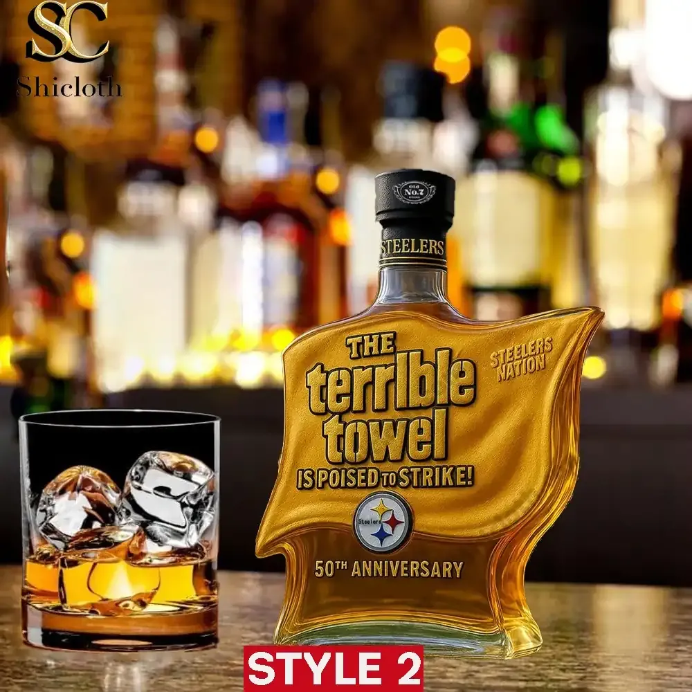 Terrible Towel shaped whiskey bottle Style Two displayed next to a whiskey glass on a bar counter!