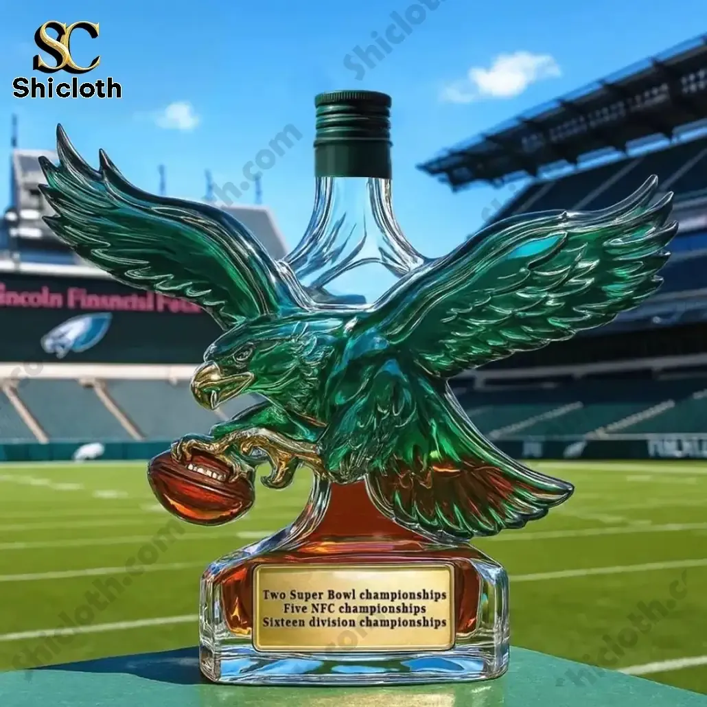 Philadelphia Eagles Retro Logo Christmas Whiskey Bottle 4 Eagle shaped whiskey bottle with green top displayed on a football field background!