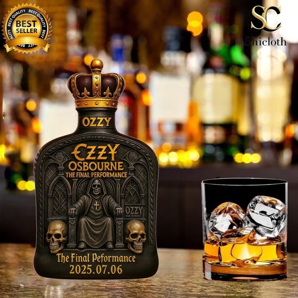 Ozzy Osbourne themed liquor bottle with crown top placed beside a glass of whiskey at a bar.