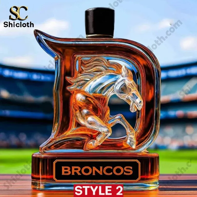 Denver Broncos 2025 Edition Christmas Whiskey Bottle 3 A Broncos themed whiskey bottle with a black cap and sculpted horse artwork inside the glass.