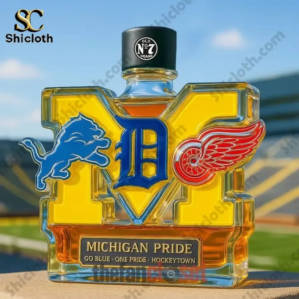 Michigan Pride Edition Christmas Whiskey Bottle 4 Michigan Pride bottle with black top featuring Michigan sports logos in an outdoor setting!
