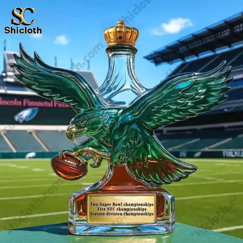 Philadelphia Eagles Retro Logo Christmas Whiskey Bottle 6 Eagle shaped whiskey bottle with gold crown top displayed on a football field!