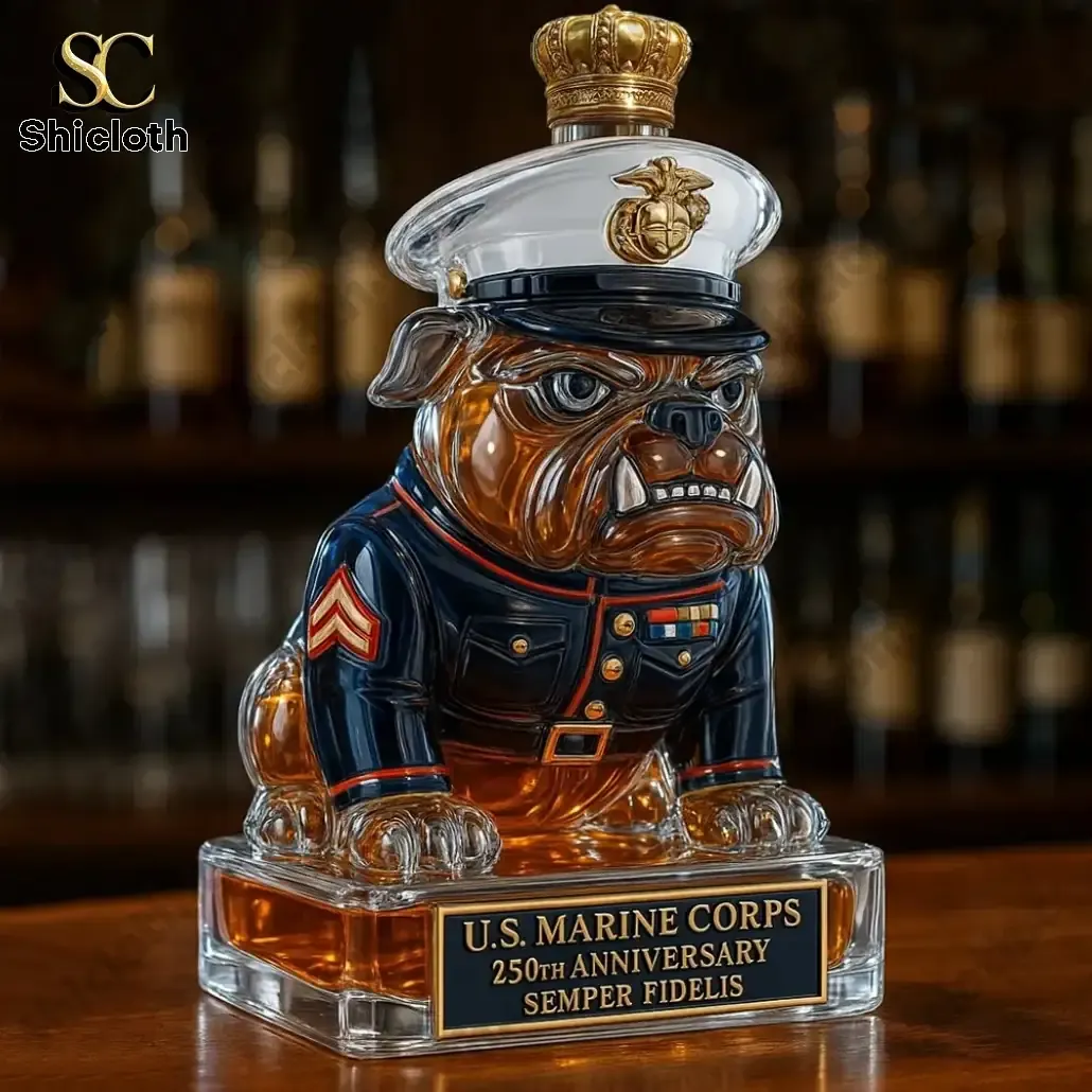 USMC 250th Anniversary Devil Dog Christmas Whiskey Bottle 3 A bulldog shaped Marine Corps themed whiskey bottle with a gold crown cap on a bar counter.