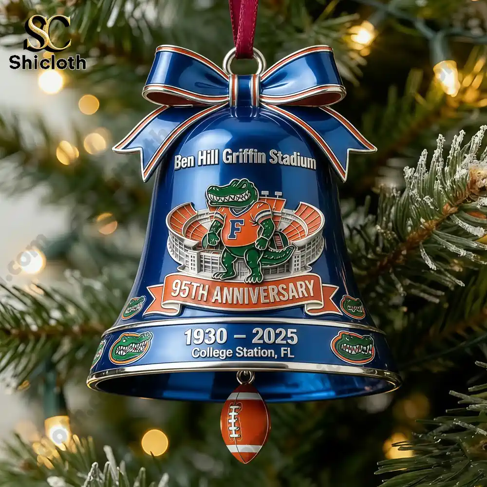 Blue holiday bell ornament featuring stadium art and an alligator mascot celebrating a ninety five year anniversary!