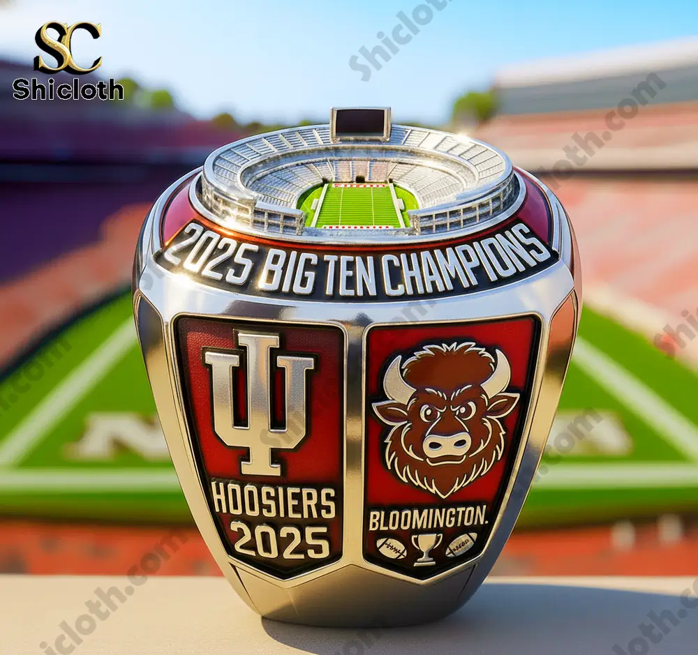 Indiana champions ring with stadium top displayed on a table in front of a football field!
