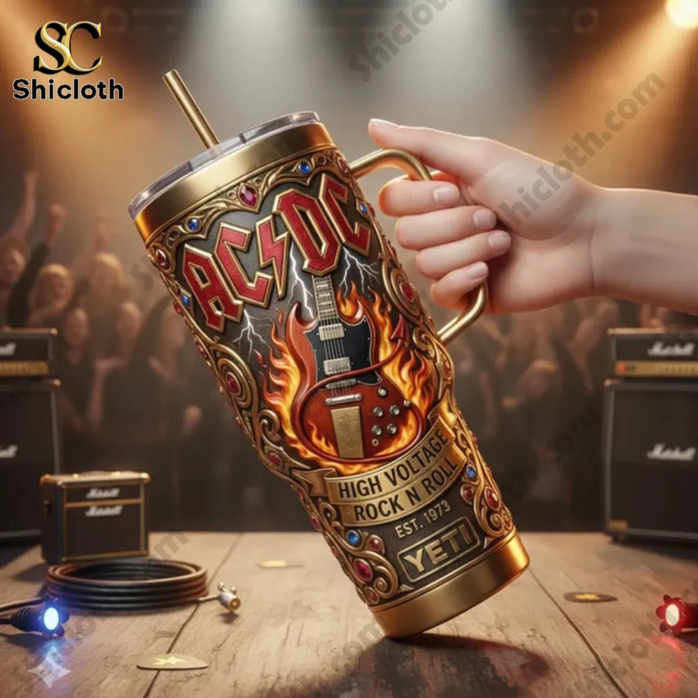 AC DC High Voltage Rock N Roll Tumbler 3 Hand holding an AC DC YETI tumbler in front of a rock concert stage!