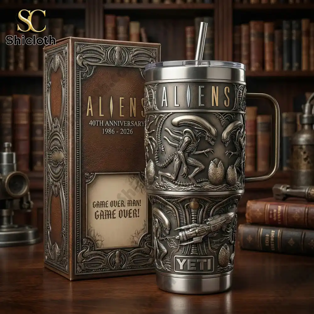 Aliens Yeti tumbler with detailed metal design and display box on wooden table!