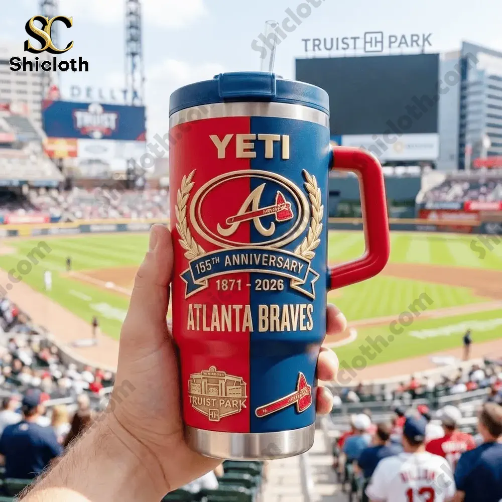Hand holding YETI Atlanta Braves anniversary tumbler inside stadium!