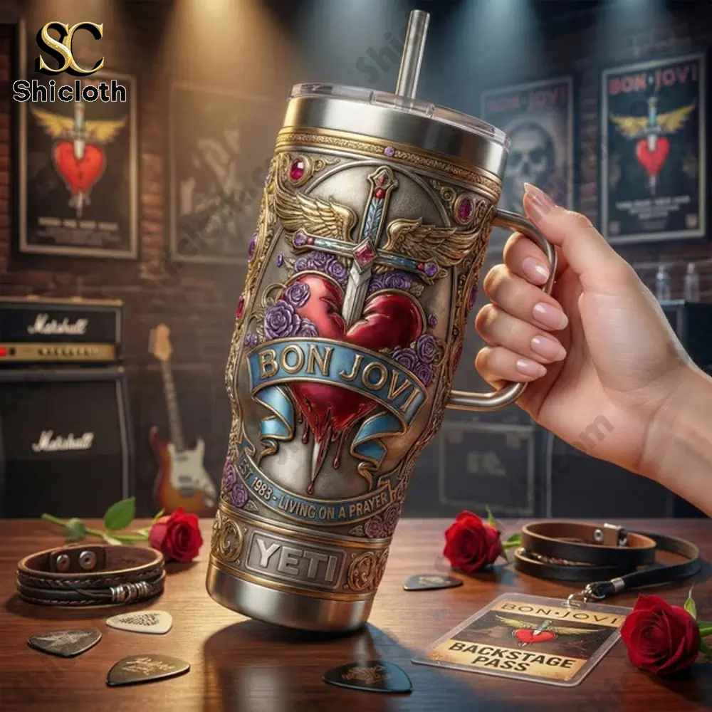 Bon Jovi Livin On A Prayer 40 Oz Tumbler 3 Hand holding Bon Jovi themed insulated tumbler on table!