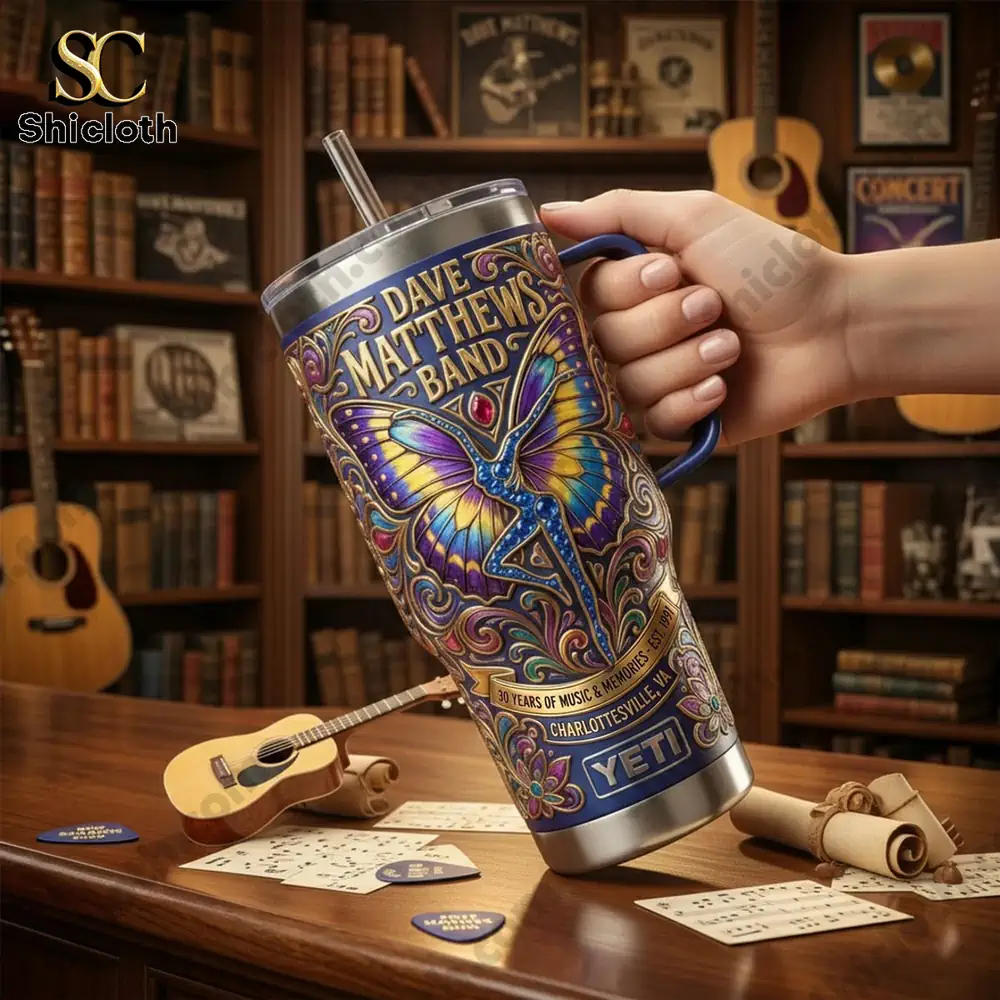 Dave Matthews Band 30 Years Of Music & Memories Tumbler 3 Hand holding Dave Matthews Band Yeti tumbler in music room!