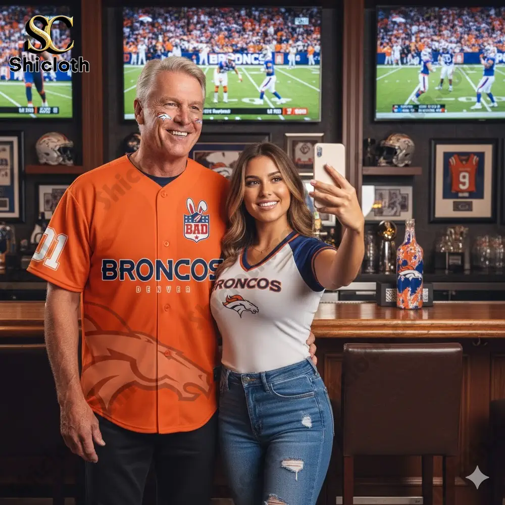 Two fans taking a selfie wearing Denver Broncos apparel!