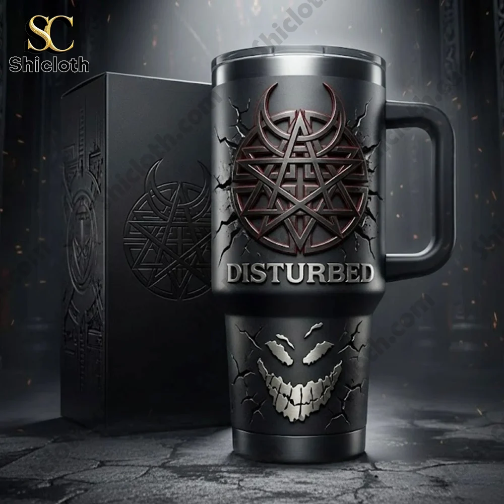 Disturbed black tumbler with branded box in dark studio.